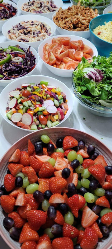 Corporate event catering with fresh salads and canapes